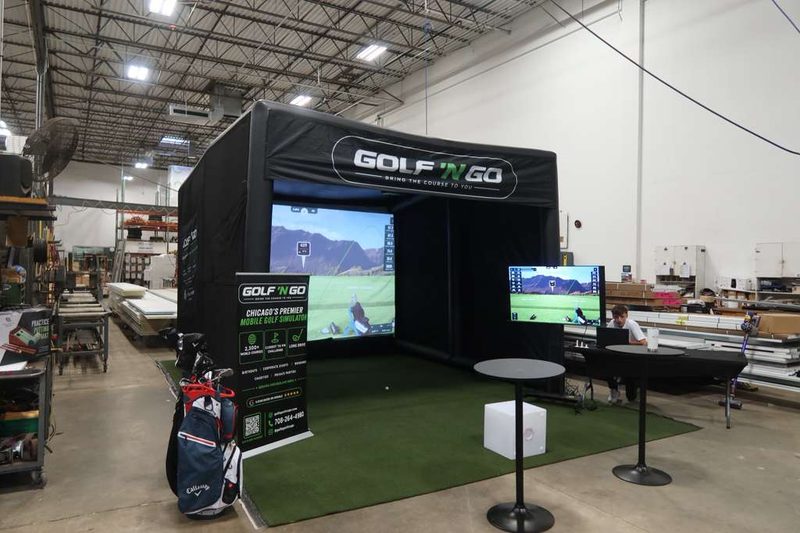 Golf 'n Go mobile golf simulator set up at a Chicagoland event — play Augusta National in Naperville