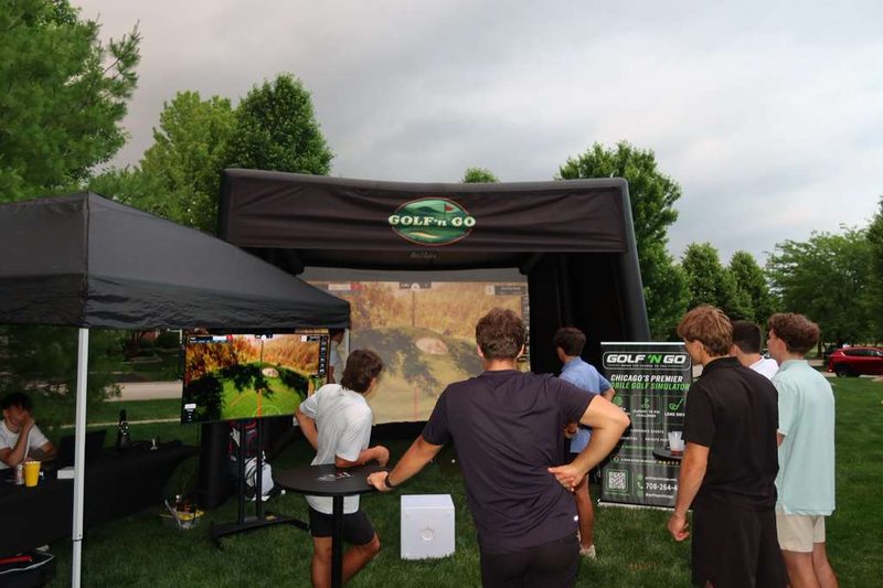 Golf 'n Go mobile golf simulator set up at a Chicagoland event — play Pebble Beach in Naperville