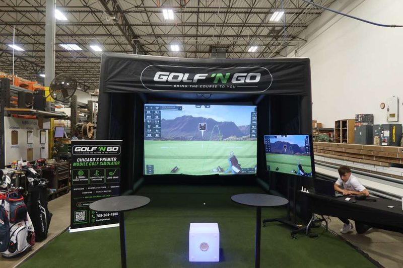 Golf 'n Go mobile golf simulator set up at a Chicagoland event — play St Andrews in Naperville