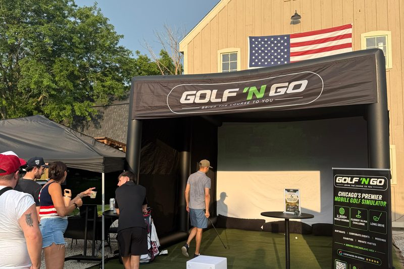 Golf 'n Go mobile golf simulator set up at a Chicagoland event — play TPC Sawgrass in Naperville