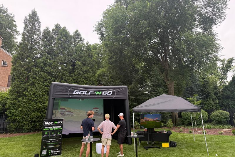 Golf 'n Go mobile golf simulator set up at a Chicagoland event — play Whistling Straits in Naperville