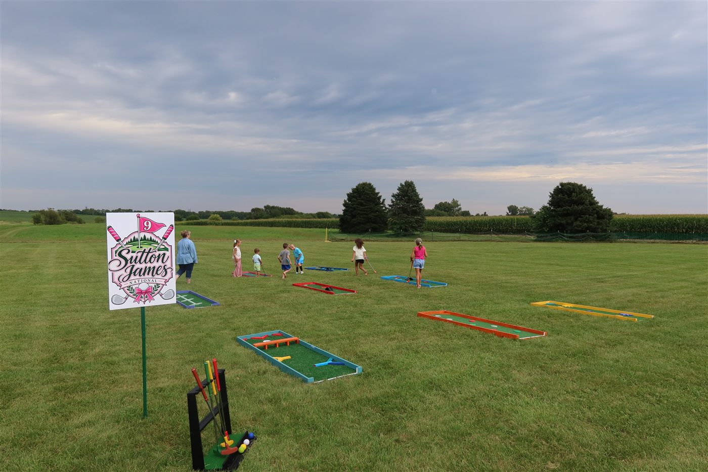 Kids and adults playing mobile mini golf at a Chicago event